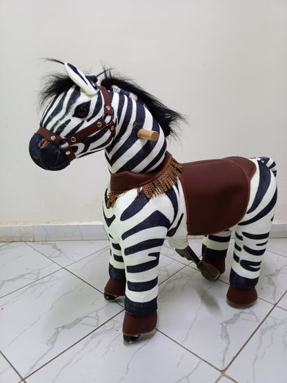 Kids ride on zebra